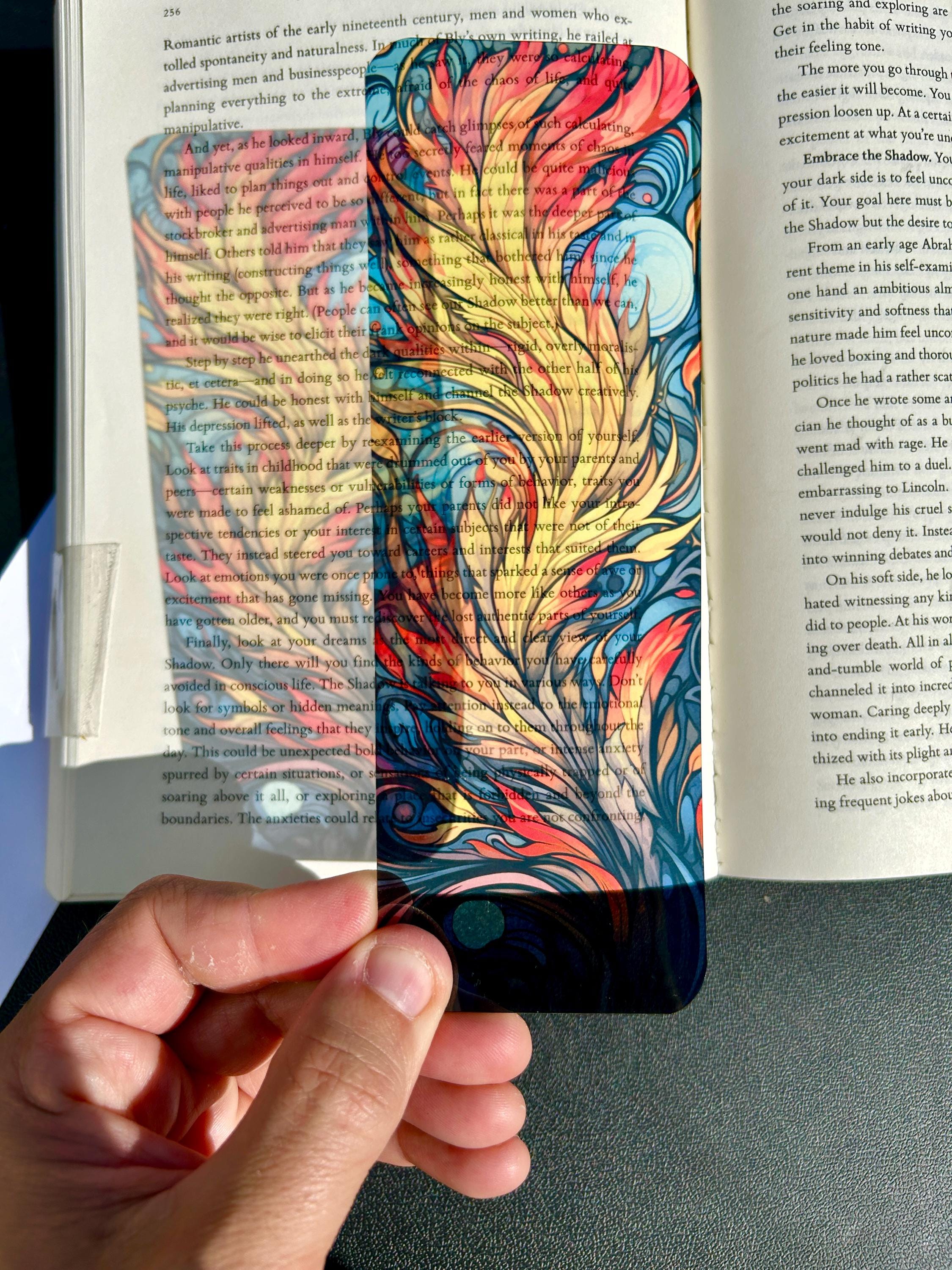 Phoenix Feather Bookmark – Fiery Abstract Flame Plume Design | Vibrant Stained Glass Fantasy Art Bookmark for Readers is a decorative bookmark made for readers, book lovers, collectors, book clubs, and giftable literary moments. It is designed as a reading accessory for books, journals, planners, and cozy reader gifts.