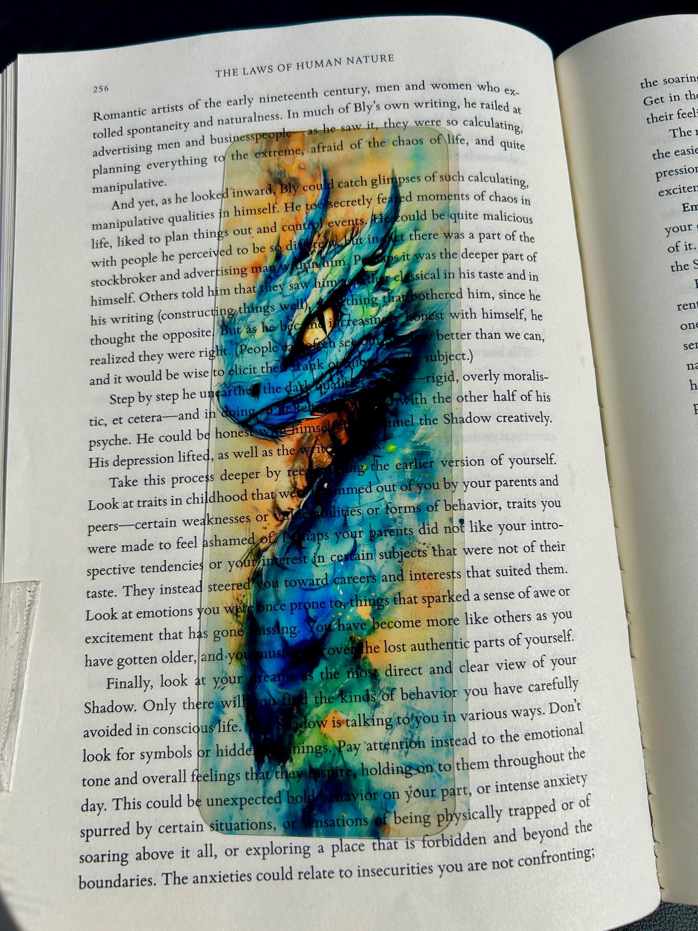Basilisk Bookmark – Watercolor Dragon, Mythical Bookmark Design, Fantasy Creature Bookmark for Book Lovers is a decorative bookmark made for readers, book lovers, collectors, book clubs, and giftable literary moments. It is designed as a reading accessory for books, journals, planners, and cozy reader gifts.