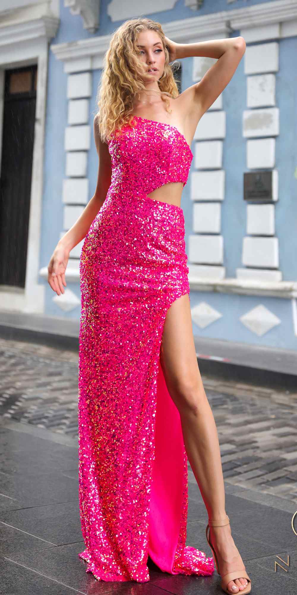 Nox Anabel A1307 Long One Shoulder Side Cut-Out Sequin Gown is a formal gown for prom, red carpet, formal events. It features sequin styling and a polished formalwear look suited for Honey Badger Books shoppers selecting special-occasion apparel.