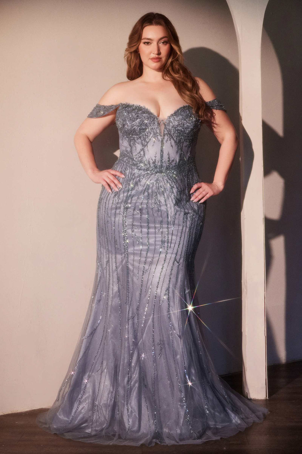 Cinderella Divine CC341C is a women’s prom gown for prom, formal events, pageants. Source details list a Fitted silhouette. Design details include Sweetheart off the shoulder neckline, sheer bodice & floral beaded motif. Fabric/material details: Sequin & bead encrusted tulle overlay lining. Fit detail: Structured bodice for enhanced support & back zipper. Colors listed: navy blue, smoky blue. Use the product options for exact color and size selection.