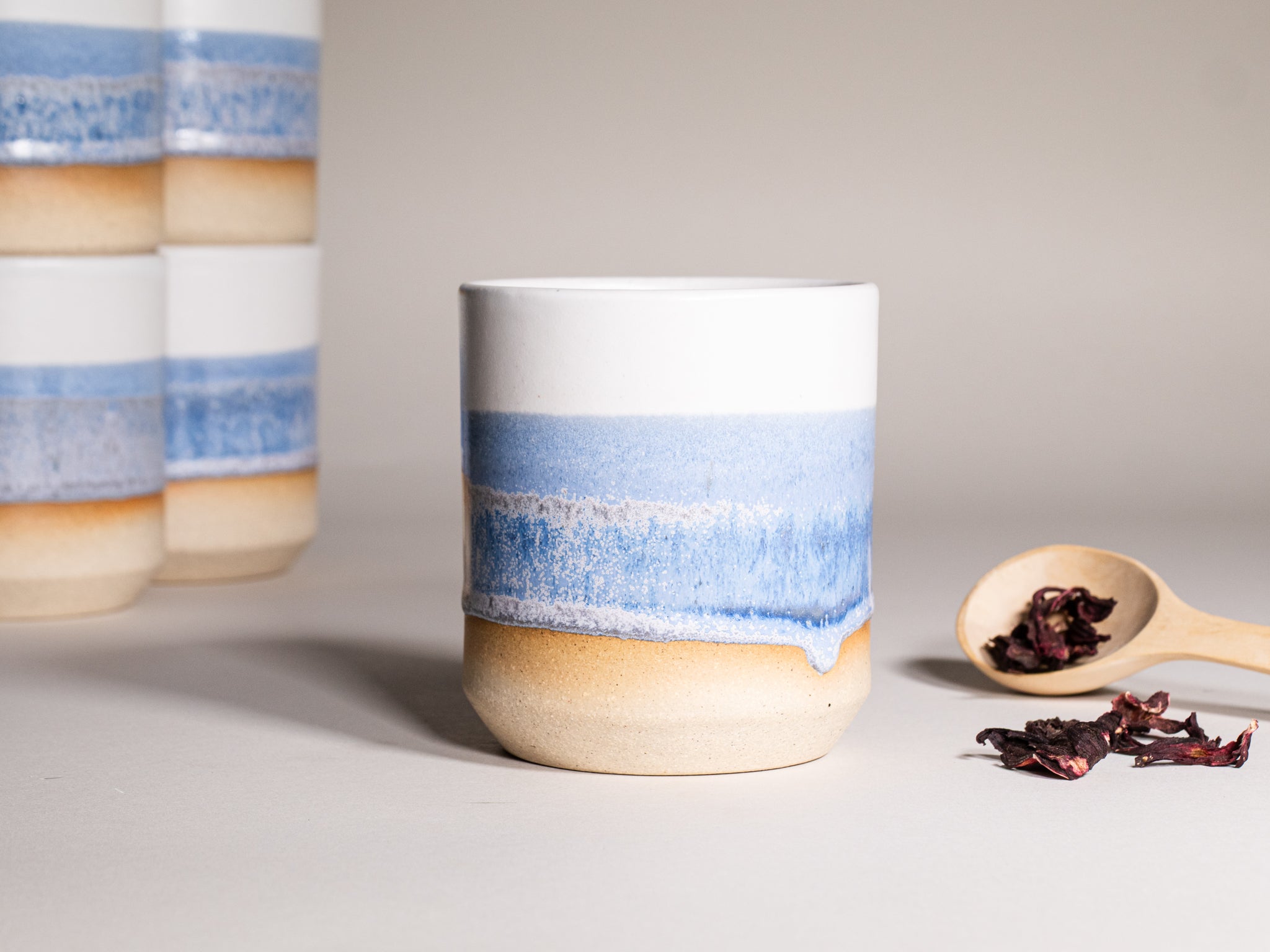 Smoothie Cup Blue Purple White 14 oz Stoneware is a stoneware tumbler selected for drinkware shoppers, coffee bars, kitchen tableware, gift sets, and cozy beverage routines. Material details include 𝗦 & 𝗗𝗘𝗦𝗜𝗚𝗡: Stoneware Clay: includes lighter and darker tones in the clay. Product details help shoppers compare the item type, style, size, and intended use before purchase.