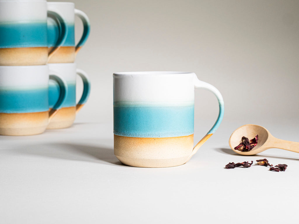 Ceramic Coffee Tea Mug with Handle Turquoise White 14 oz Stoneware is a stoneware coffee mug selected for drinkware shoppers, coffee bars, kitchen tableware, gift sets, and cozy beverage routines. Material details include 𝗦 & 𝗗𝗘𝗦𝗜𝗚𝗡: Stoneware Clay: includes lighter and darker tones in the clay. Product details help shoppers compare the item type, style, size, and intended use before purchase.