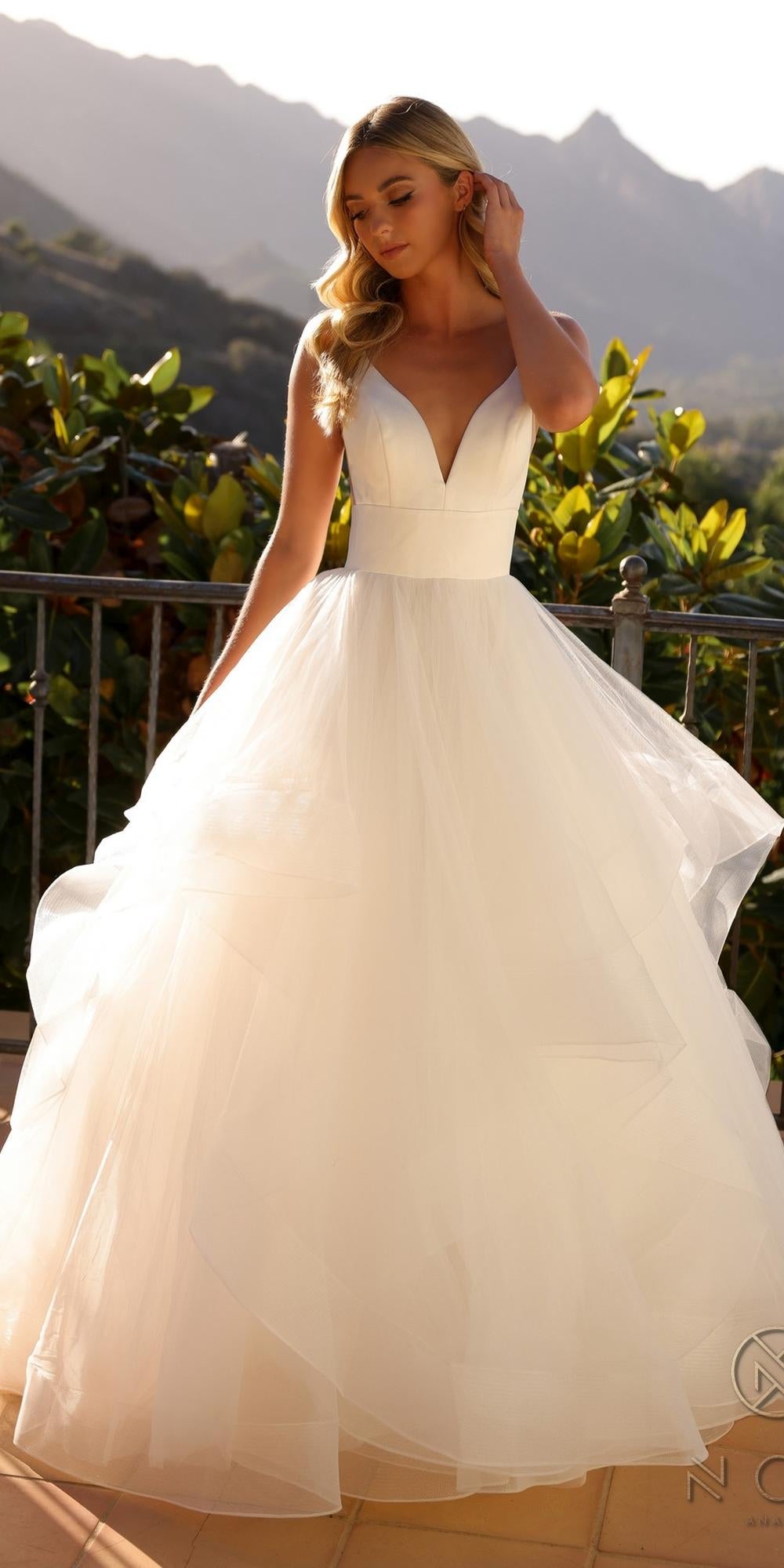 Nox Anabel JE997 Long Sleeveless Layered A-Line Wedding Gown is a a-line wedding dress for wedding, formal events. It features tulle styling and a polished formalwear look suited for Honey Badger Books shoppers selecting special-occasion apparel.