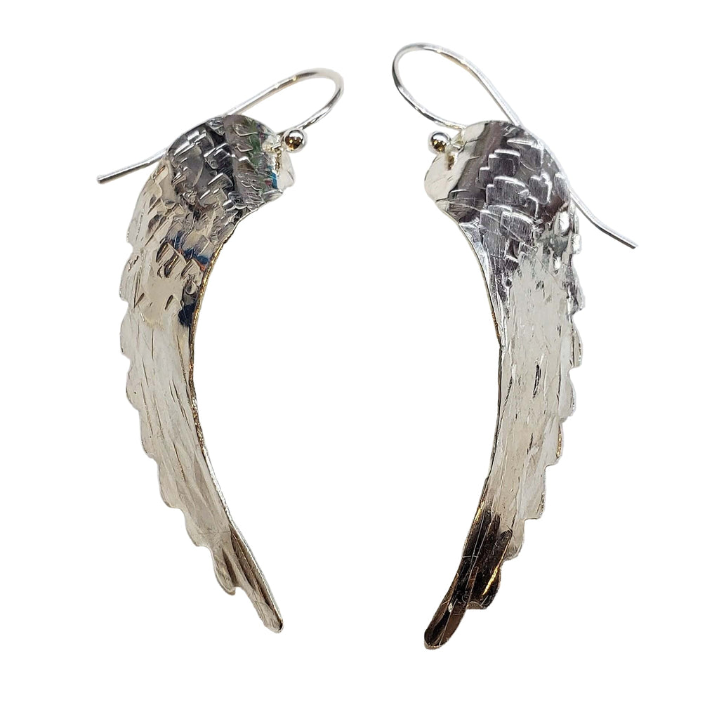 Silver Hammered Sculpted Angel Wing Earrings is handmade earrings selected for shoppers looking for artisan jewelry, statement accessories, wearable gifts, and distinctive details. Design details include silver or sterling-silver detail, hammered texture, angel wing shape. Product details help shoppers compare the item type, style, size, and intended use before purchase.