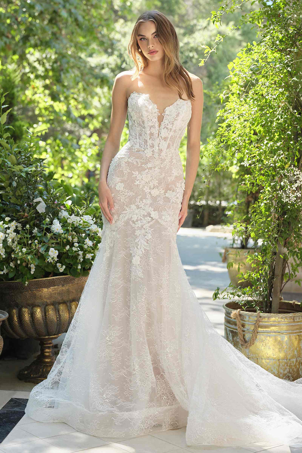 Andrea & Leo WL072 is a women’s wedding dress for wedding, formal events. Source details list a Fit-and-flare silhouette. Design details include Strapless plunge neckline with floral lace appliqué. Fabric/material details: Sheer lace overlay with nude lining. Fit detail: Structured corset bodice with flattering contour seams. Colors listed: off white/nude. Use the product options for exact color and size selection.