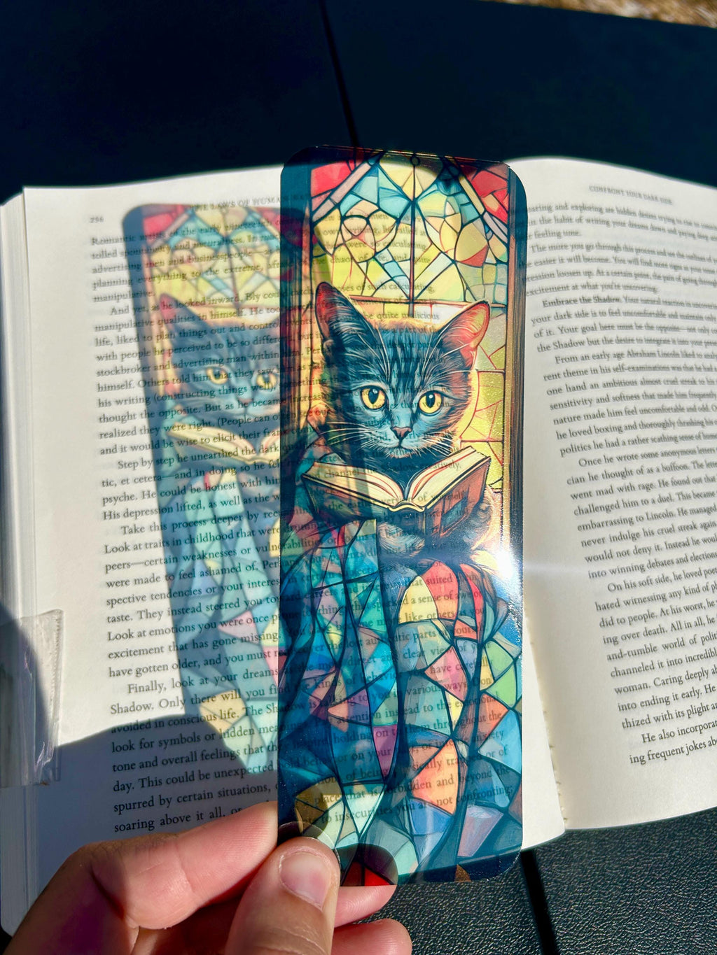 Cozy Black Cat Reading Bookmark with Stained Glass Quilt and Golden Window Glow – Warm Bookish Art for Night Readers, Dreamers is a decorative bookmark made for readers, book lovers, collectors, book clubs, and giftable literary moments. It is designed as a reading accessory for books, journals, planners, and cozy reader gifts.