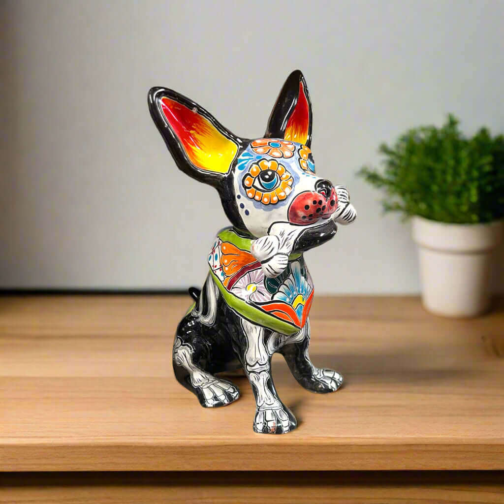 Talavera Chihuahua Holding Bone | Day of the Dead Dog Figurine is a hand-painted ceramic figurine chosen for home decor, collector displays, shelves, desks, mantels, and giftable accent pieces. The listing focuses on decor use, ceramic style, display value, and product details.