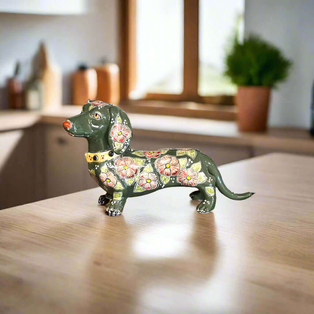 Talavera Dachshund Statue | Colorful Hand-Painted Dog Figurine is a hand-painted ceramic figurine chosen for home decor, collector displays, shelves, desks, mantels, and giftable accent pieces. The listing focuses on decor use, ceramic style, display value, and product details.