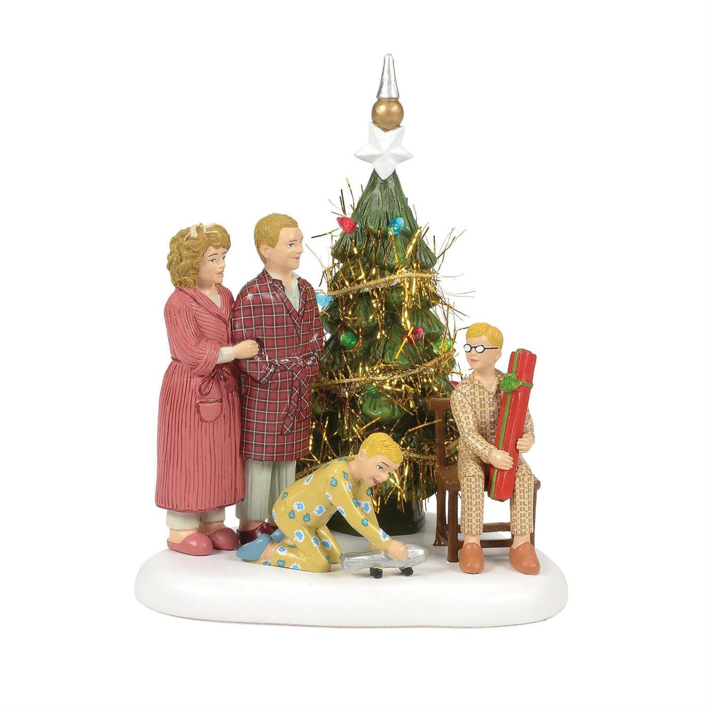 The Family Opens Their Gifts is a Christmas village decor piece suited for seasonal displays, collector shelves, holiday scenes, and festive gifting.